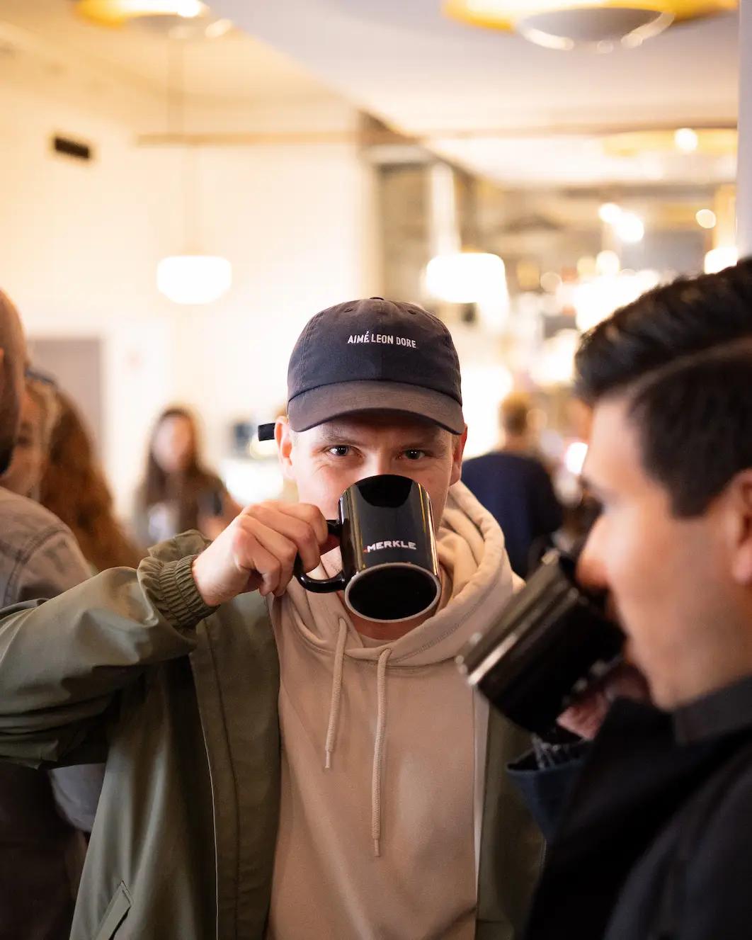 Merkle Mornings drinking coffee